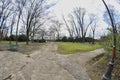 Crossroads path in a public park trees in a public park no leaves fisheye lens