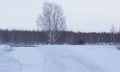 Crossroads in winter in the snow on a country highway