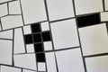 Crossshaped detail of a mosaic of white clinkers of the train station designed by artist Friedensreich Hundertwasser in Uelzen, Royalty Free Stock Photo