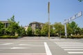 Crosswalk on asphalted road in city of sunny summer Royalty Free Stock Photo