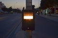 Crosswalk button for pedestrian in evening. Push this button to cross
