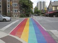 Crosswalk painted with the LGBT flag, gay pride flag; Rainbow. Royalty Free Stock Photo