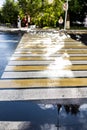 crosswalk on the road for safety when people walking cross the street, Pedestrian crossing on a repaired asphalt road Royalty Free Stock Photo