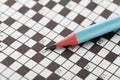 Crossword puzzle and blue pencil Royalty Free Stock Photo