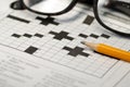 Crossword puzzle,pencil and reading glasses Royalty Free Stock Photo