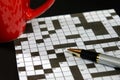 Crossword puzzle with red mug Royalty Free Stock Photo