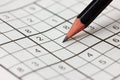 Crossword sudoku and pencil Royalty Free Stock Photo