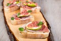Crostini with fresh fig, peppermint and prosciutto ham Royalty Free Stock Photo