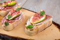 Crostini with fresh fig, peppermint and prosciutto ham Royalty Free Stock Photo