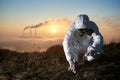 Scientist and smoking stacks of thermal power station