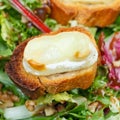 Crouton with goat cheese on fresh lettuche Royalty Free Stock Photo