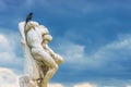 Crow on statue The Spartacus Oath in the Tuileries Gardens in Pa