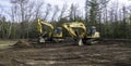 CROW WING CO, MN - 10 MAY 2023: Brown soil and two excavators