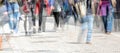 Crowd of abstract people walking in the shopping pedestrian zone, multiple exposure and motion blur, panoramic format, copy space Royalty Free Stock Photo