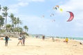 Crowd of active sporty people enjoying kitesurfing holidays and activities on perfect sunny day on Cabarete tropical