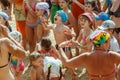 A crowd of adults and children on the beach party is dancing and having fun. Tourists are resting on the Mediterranean Sea Royalty Free Stock Photo