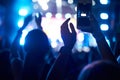 Crowd of audience with hands using camera phone to take pictures and videos at live concert, smartphone records live music festiva Royalty Free Stock Photo