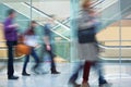 Crowd of Blurred Young People Walking Along Modern Corridor Royalty Free Stock Photo