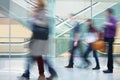 Crowd of Blurred Young People Walking Along Modern Corridor Royalty Free Stock Photo