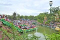 Crowd of Buddhists are offering incense to Buddha with thousand hands and thousand eyes in the Suoi Tien park in Saigon