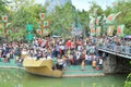 Crowd of Buddhists are offering incense to Buddha with thousand hands and thousand eyes in the Suoi Tien park in Saigon