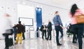 Crowd of business people at a trade show booth