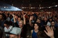 Crowd of cheerful people partying at a live concert