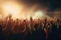 Crowd cheering at a music festival with hands raised in the air, Crowd raising hands in the air and enjoying a concert at a Royalty Free Stock Photo