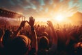 Crowd cheering at a music festival with hands raised up. Music festival concept, Crowd raising hands in the air and enjoying a Royalty Free Stock Photo