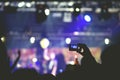 Crowd, cheering and watching a band on stage Royalty Free Stock Photo