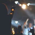 Crowd, cheering and watching a band on stage Royalty Free Stock Photo