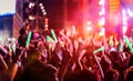 Crowd clap or hands up at concert stage lights Royalty Free Stock Photo