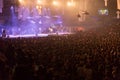 Crowd at concert and blurred stage lights, noise added later in Royalty Free Stock Photo