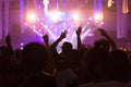 Crowd at concert and blurred stage lights, noise added later in Royalty Free Stock Photo