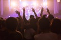 Crowd at concert and blurred stage lights, noise added later in Royalty Free Stock Photo