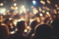 Crowd at concert in front of stage lights, defocused background Royalty Free Stock Photo