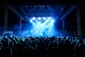 Crowd at concert under blue lights