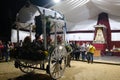Crowd with donkey and a cart in front of the icon of virgin of Rocio during pilgrimage
