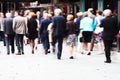 Crowd of dressed up people walking to a concert