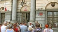 Crowd of elderly tourists listening to the guide. People enjoy excursion