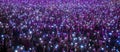 A crowd of enthusiastic spectators at a live concert, smartphones in their hands. ai generative Royalty Free Stock Photo