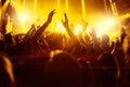 Crowd of fans at concert at music festival,  silhouettes of raised hands, unrecognizable people Royalty Free Stock Photo