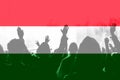 Crowd of football, soccer fans with raised arms, blending Hungary flag Royalty Free Stock Photo