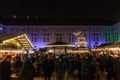 Crowd gathering on front of the stands of the Munich Christmas market Christkindlmarkt.