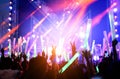 Crowd of hands up concert stage lights Royalty Free Stock Photo