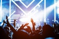 Crowd of hands up concert stage lights Royalty Free Stock Photo