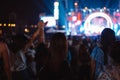 Crowd of hands up concert stage lights and people fan audience silhouette raising hands in the music festival rear view with Royalty Free Stock Photo