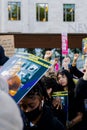 Crowd holding up their fists in solidarity to the death of Chris Kaba