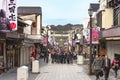 Crowd of Japanese college students during a school excursion in the Dazaifu Tenmangu Sando Shopping street.