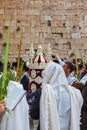 Crowd of Jewish worshipers in white wearing